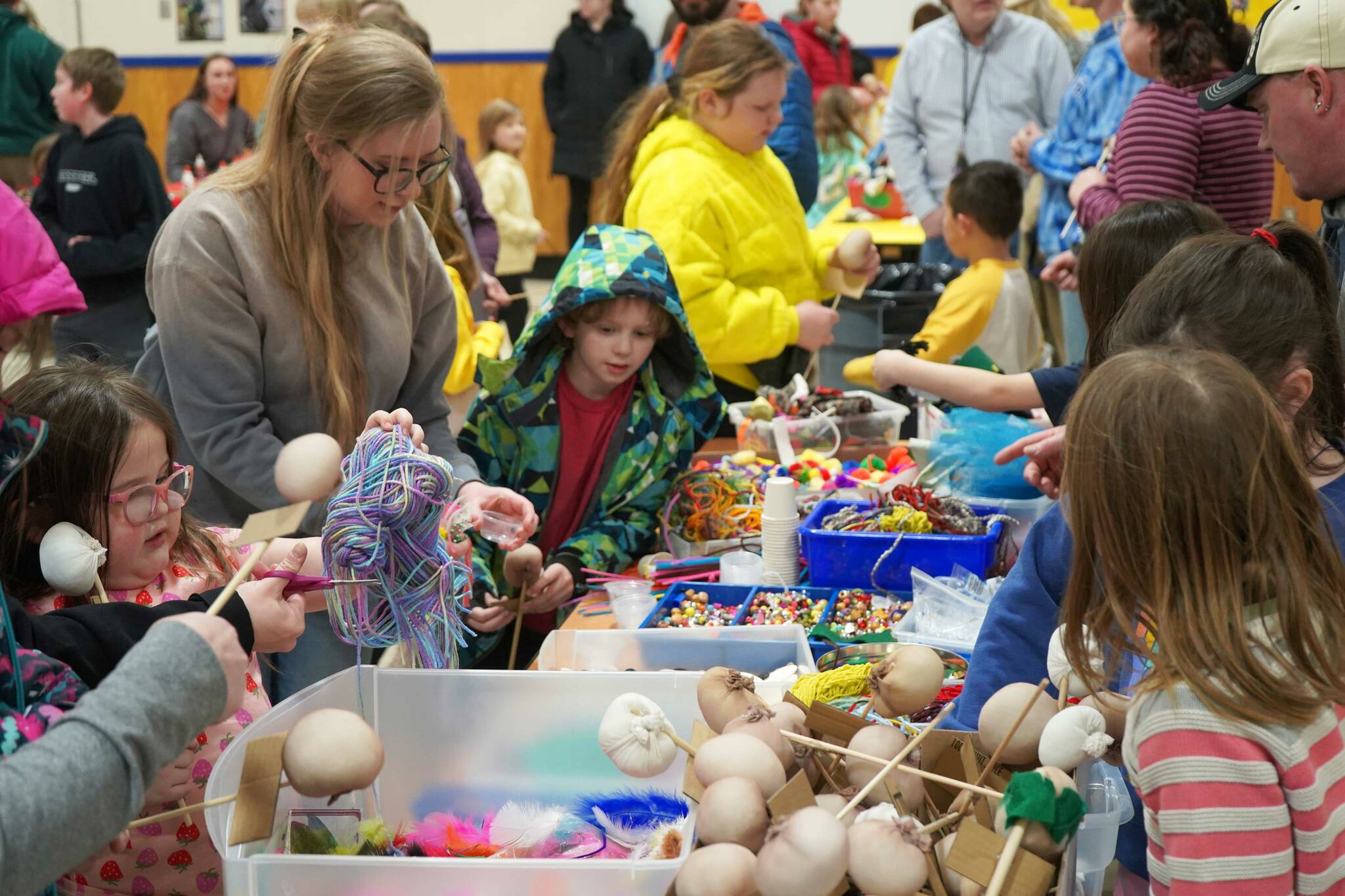 Students and families create puppets during a family art night hosted by Artist in Residence Shala Dobson at Kaleidoscope School of Arts and Science in Kenai, Alaska, on Thursday, Feb. 27, 2025. (Jake Dye/Peninsula Clarion)