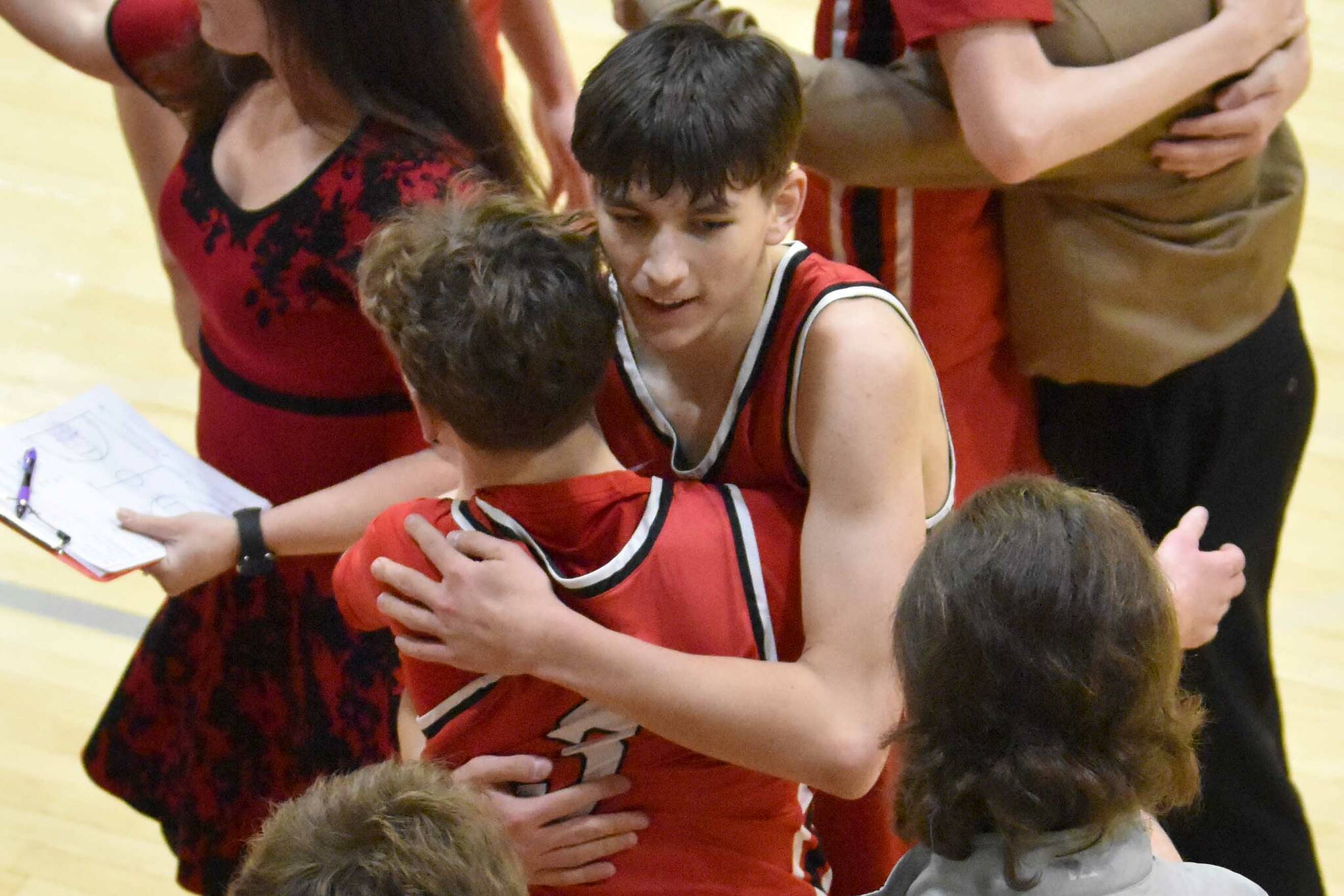 Kenai Central celebrates winning the championship Saturday, March 8, 2025, at the Peninsula Conference tournament at Nikiski Middle-High School in Nikiski, Alaska. (Photo by Jeff Helminiak/Peninsula Clarion)