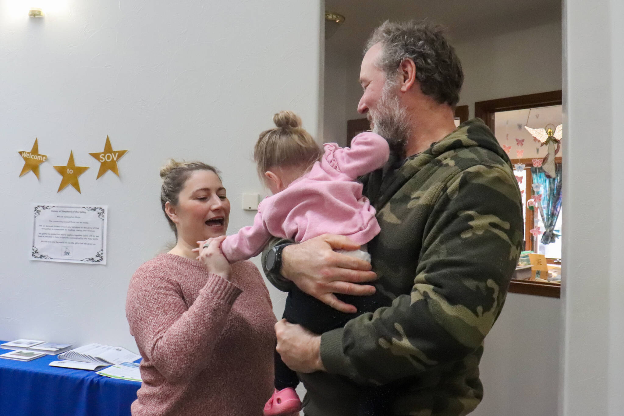 Sabrina Donnellan and her family attend a community luncheon for federal employees at Shepherd of the Valley Lutheran Church on Saturday, March 8, 2025. (Jasz Garrett / Juneau Empire)