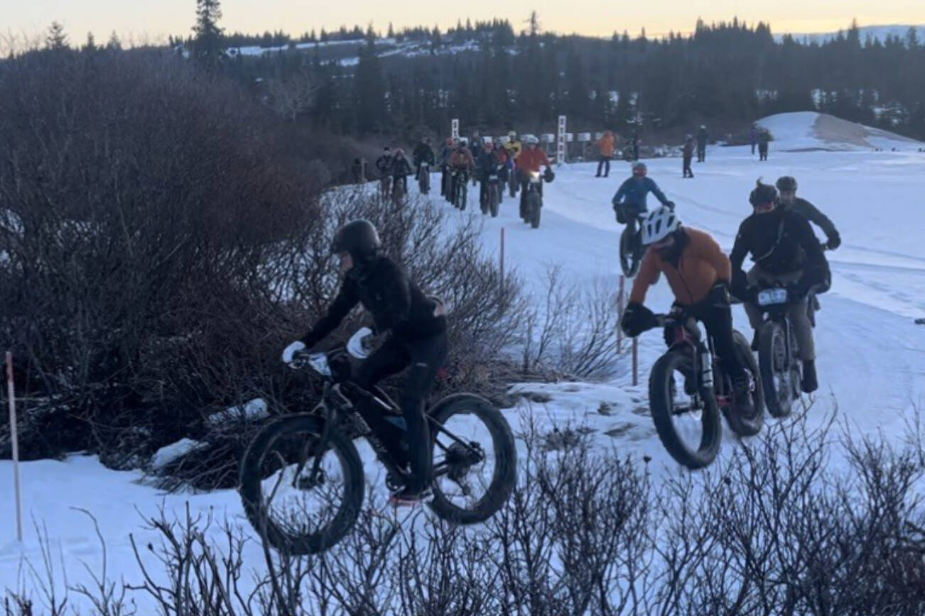 Bicyclists race around a corner during the 2025 Homer Epic fundraiser for the Homer Cycling Club. (Photo courtesy of Jake Schlapfer)