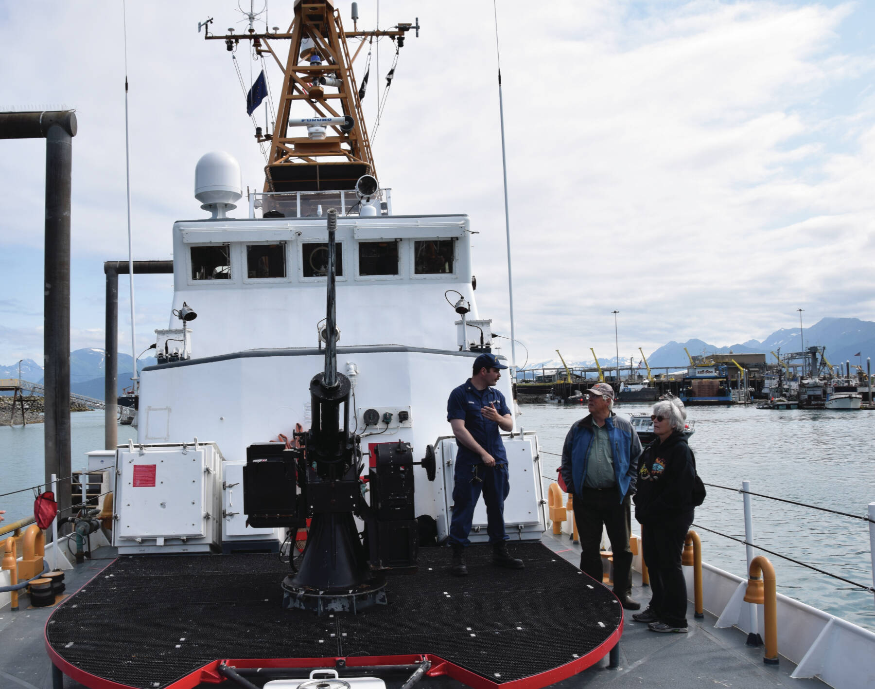 U.S. Coast Guard officer Alexander Curran shows Homer visitors the bow of the USCG cutter Naushon on Aug. 4, 2023, in Homer, Alaska. (Emilie Springer/ Homer News.)